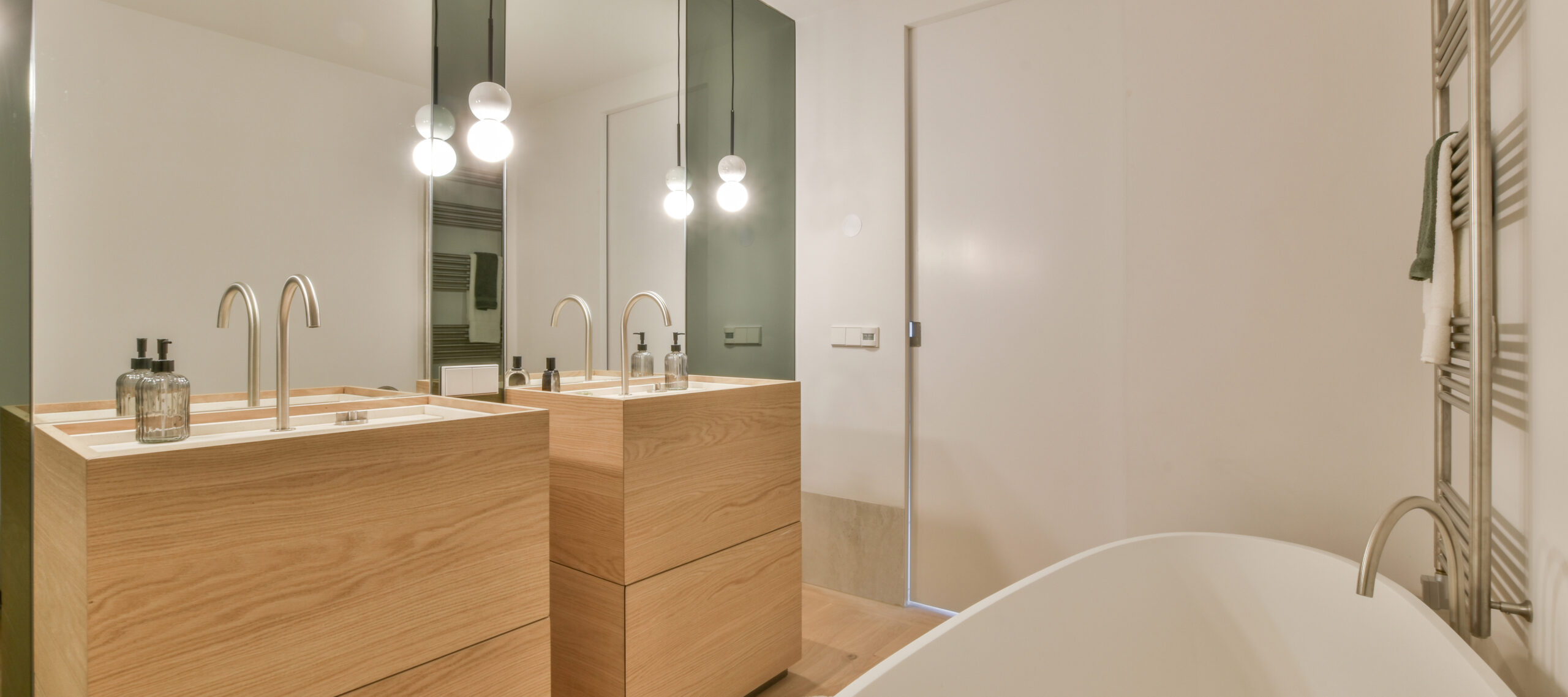 Modern bathroom with shower, bathtub and sink